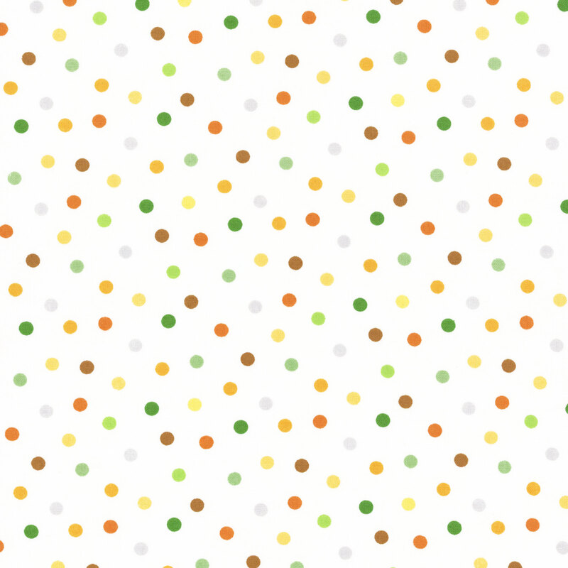 white fabric with multicolored polka dots in green, yellow, tan, and brown