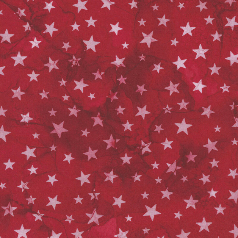 red watercolor fabric with white stars across it