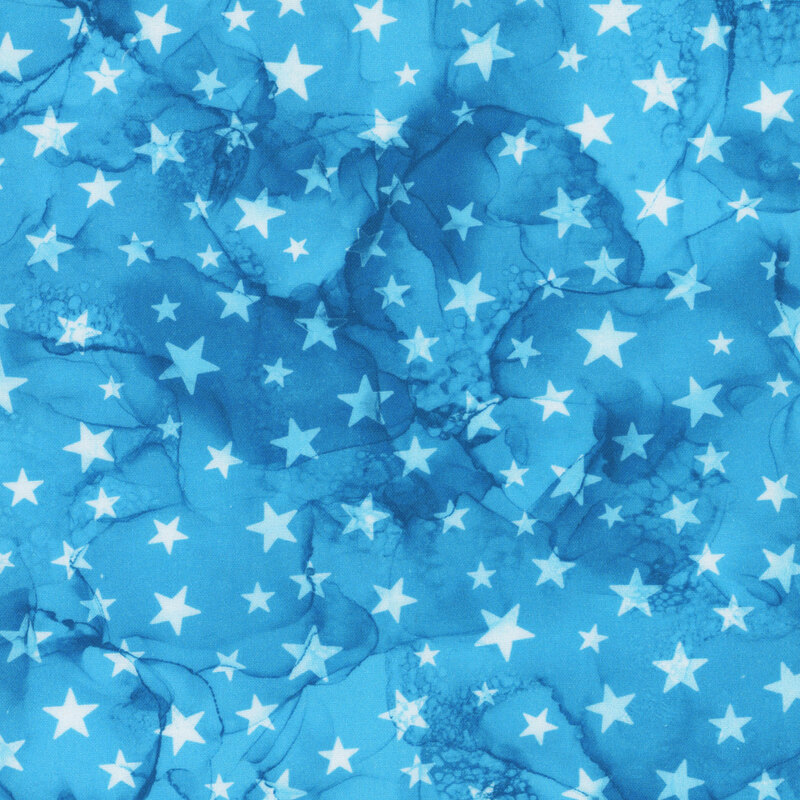 light blue watercolor fabric with white stars across it