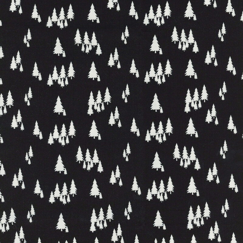 fabric featuring white pine trees on a black background
