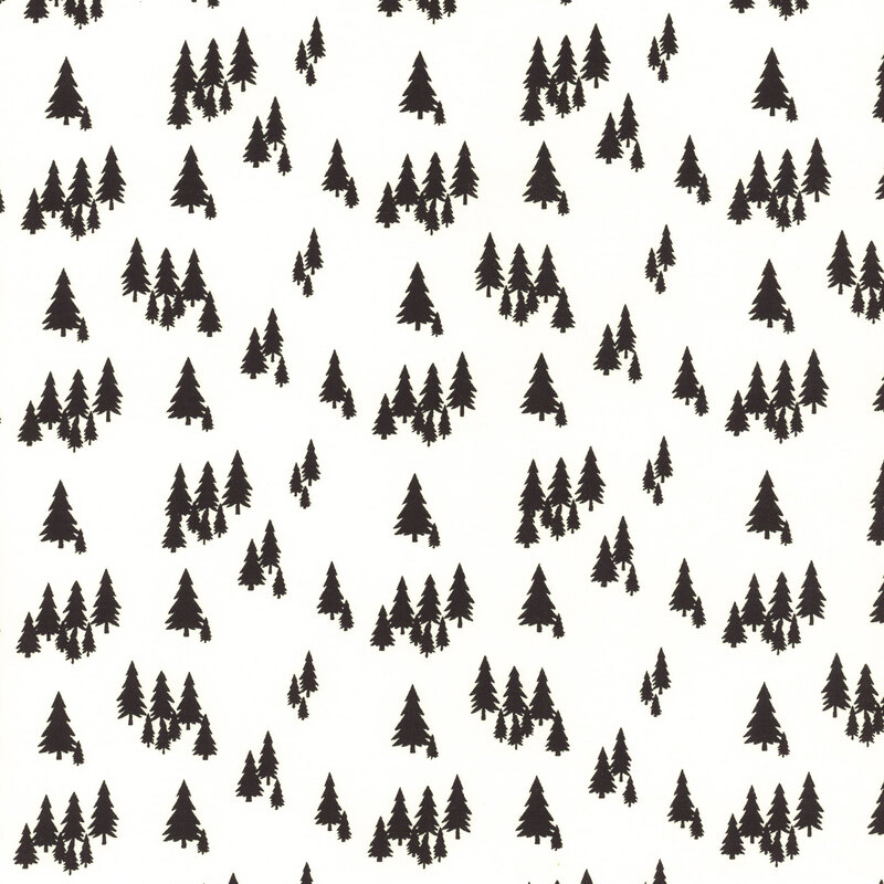 fabric featuring black pine trees on a solid cream colored background