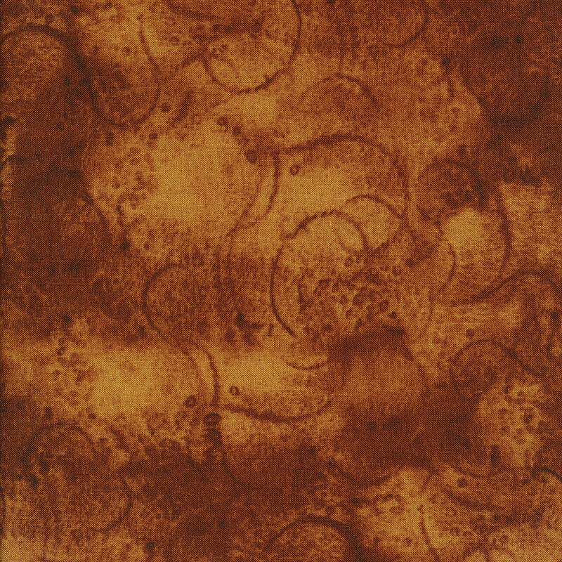 Warm brown mottled fabric with swirls and partial tonal circles all over for a textured effect