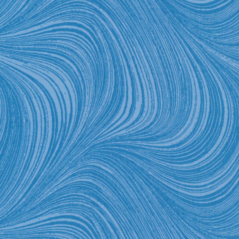 Medium blue fabric with pale blue swirls and fine waving lines.