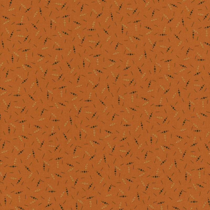 pattern of 3 little dots tossed on an orange background