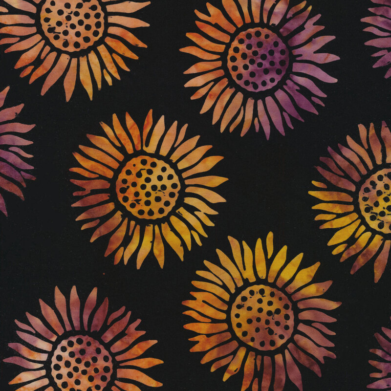 black fabric with round sunflowers spaced evenly apart with an orange and purple mottled watercolor look