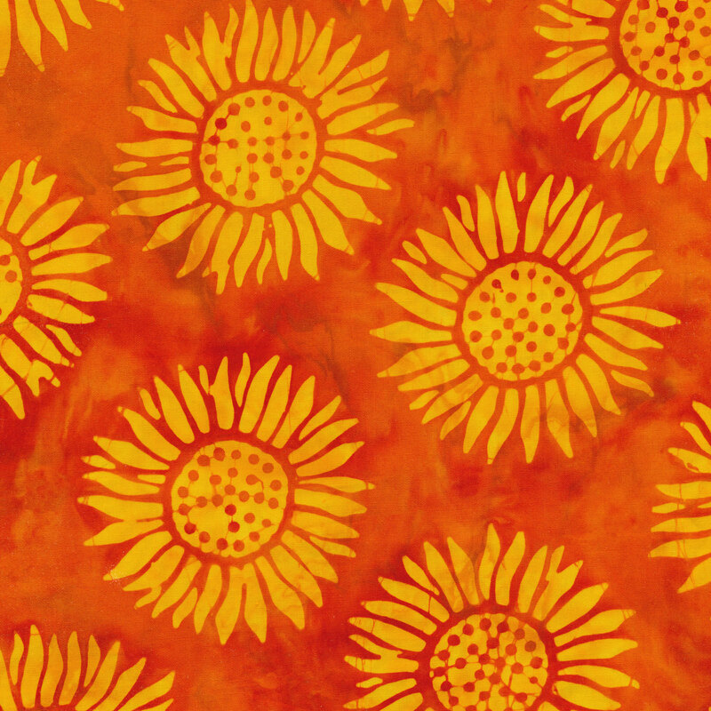 bright orange mottled fabric with round sunflowers spaced evenly apart with a yellow mottled watercolor look