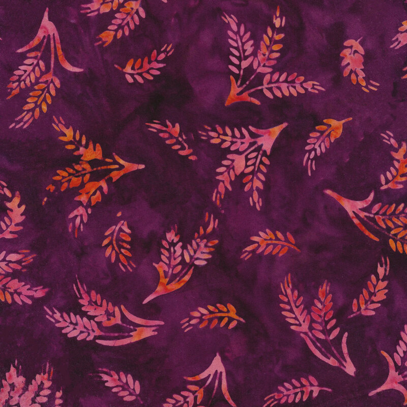 Mottled purple fabric with tossed wheat ears spaced evenly apart with an orange and pink mottled watercolor look