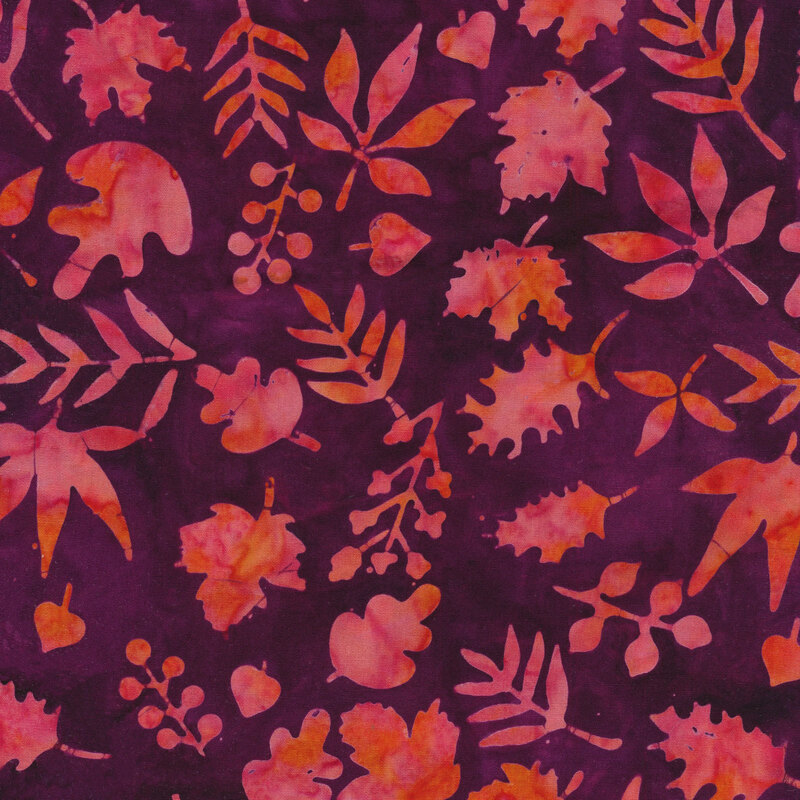 purple mottled fabric with tossed leaves all over in a mottled hot pink and orange watercolor look