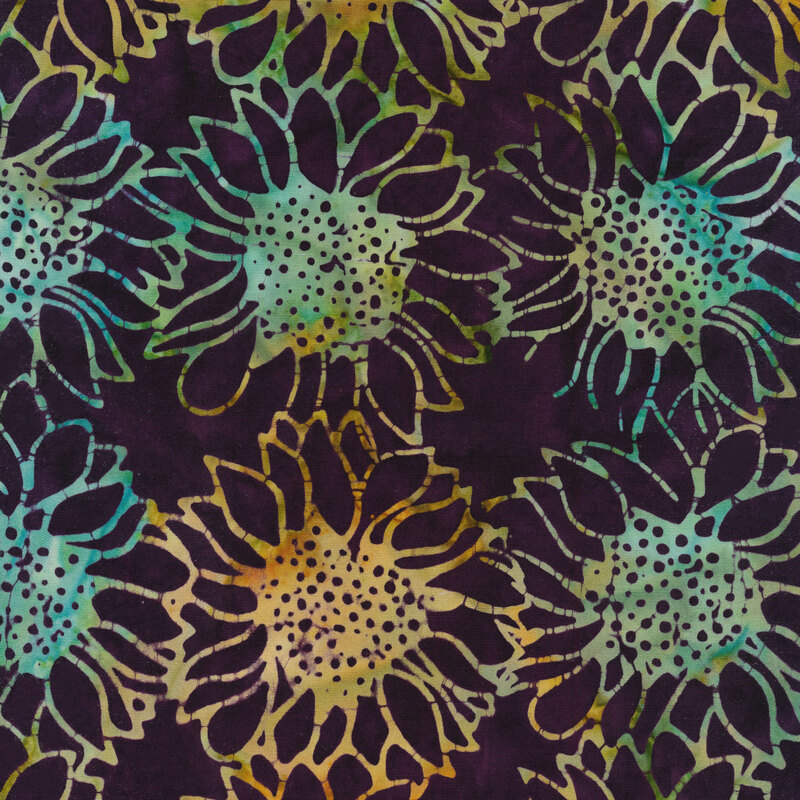 dark purple mottled fabric with tossed large sunflowers in a mottled blue and orange watercolor look