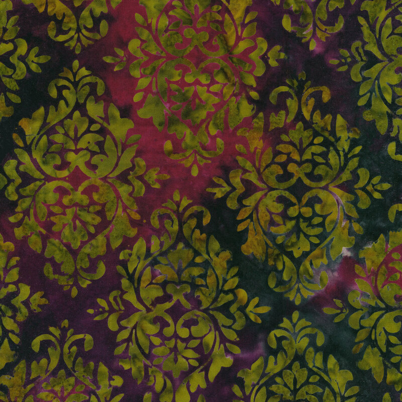 pink and purple mottled fabric with damask patterns mottled with shades of green and orange