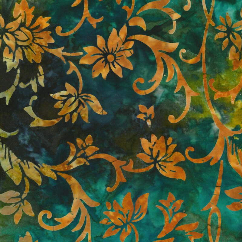 green and teal mottled watercolor fabric with mottled orange vines with filigree-like flowers and leaves curling all over