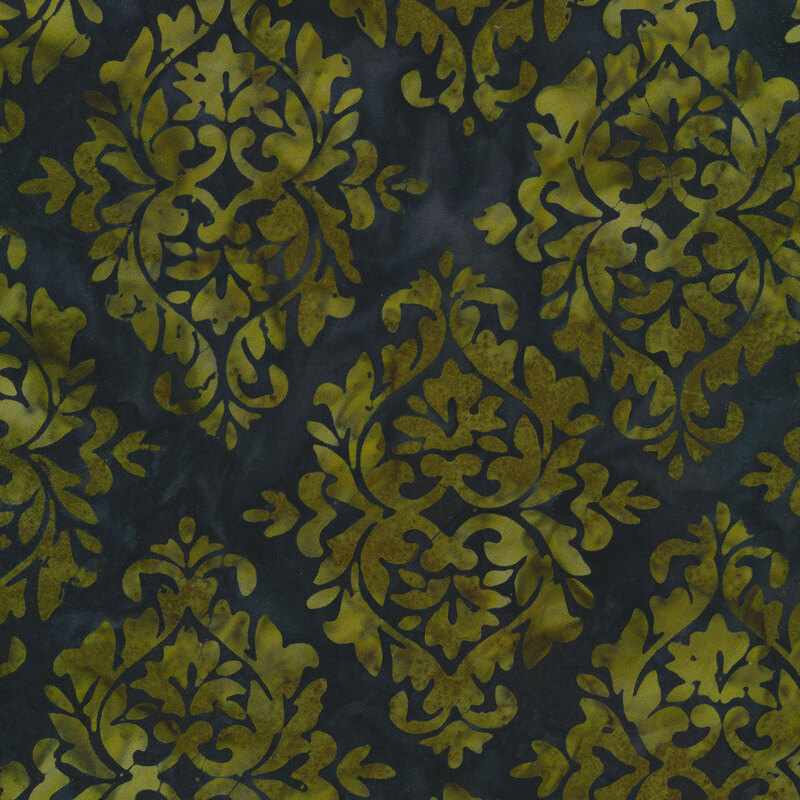 Dark blue/teal mottled fabric with damask patterns mottled with shades of pea green