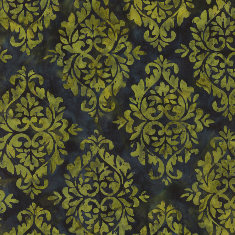 Dark blue/teal mottled fabric with damask patterns mottled with shades of pea green