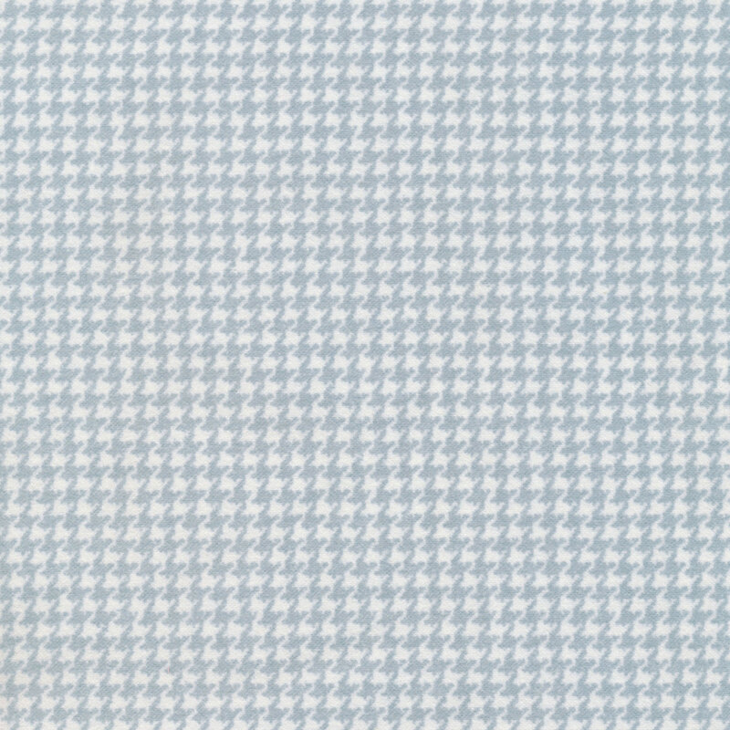 flannel fabric with a light blue and white houndstooth design