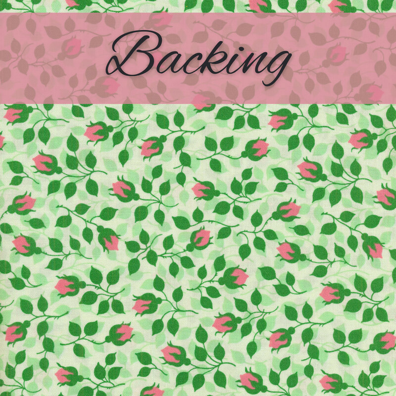 Fabric for the orange blossom throw quilt local honey kit backing, featuring green rose vines with pink buds, labeled by a pink banner that says 