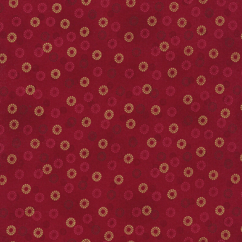 Red mottled fabric with rings of gold metallic shining 