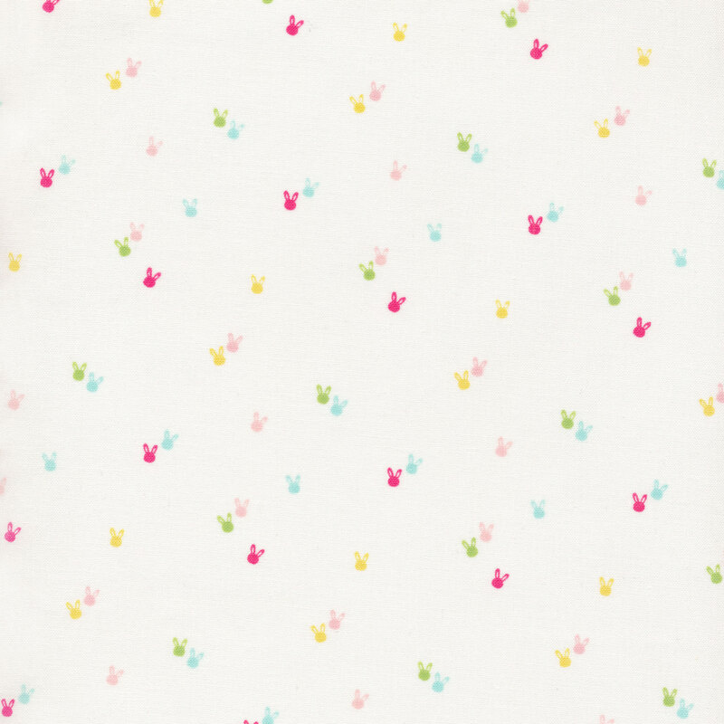 soft white fabric with multicolor bunny head motifs scattered across it