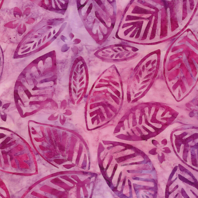 Fabric with magenta tossed leaves and flowers on a pink and purple mottled background