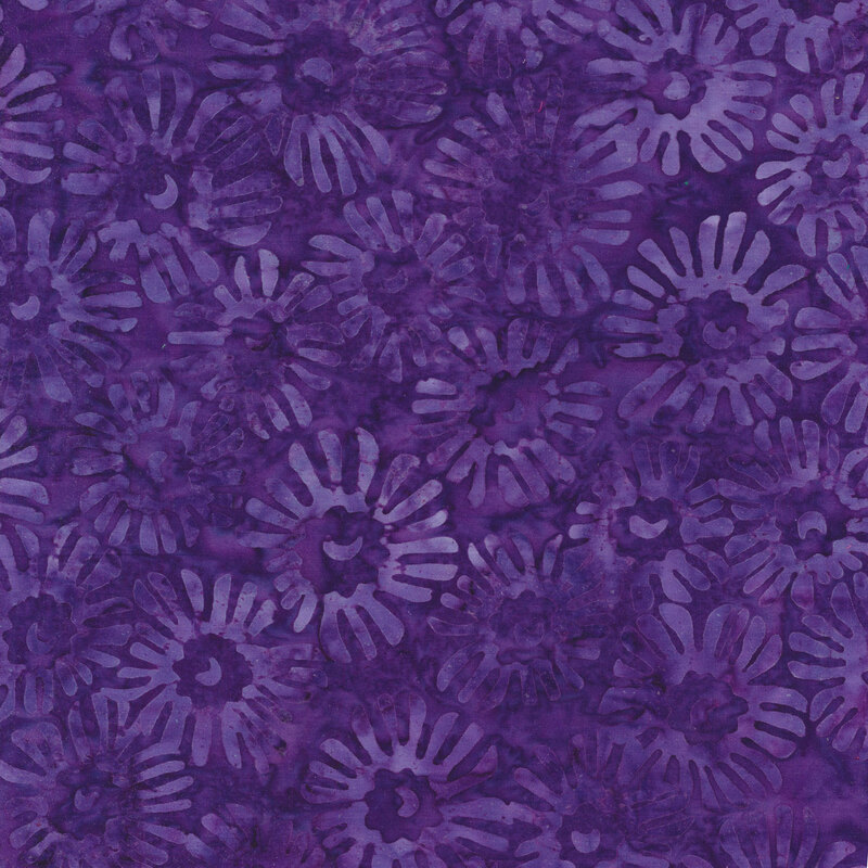 Fabric with abstract purple flowers on a dark purple mottled background