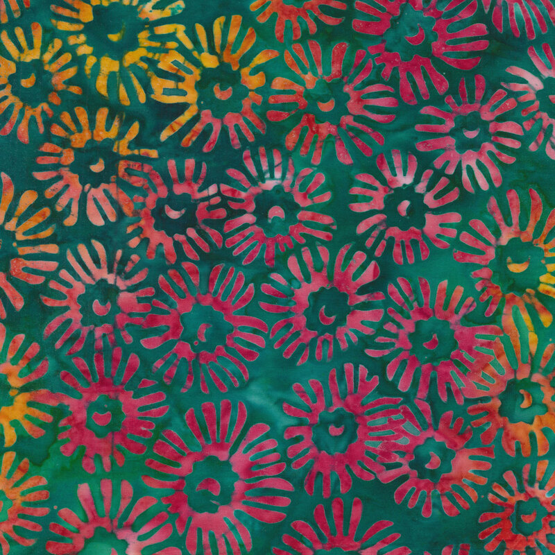 Fabric with multicolored pink, orange and yellow flowers on a mottled green and teal background