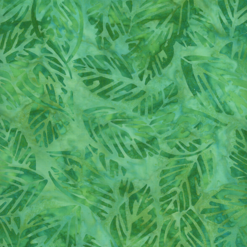 Fabric with kelly green leaves on a tonal green background