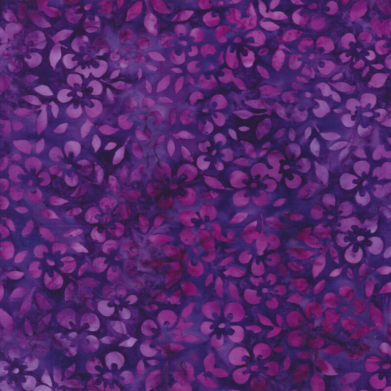 Fabric packed with purple magenta flowers on a cool violet background