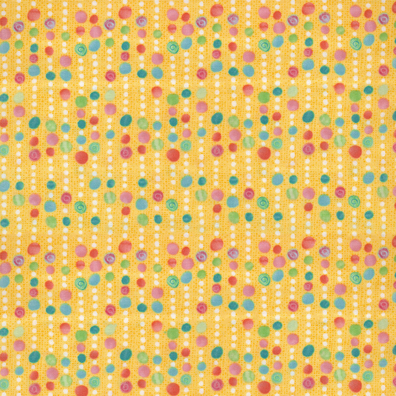 Yellow fabric with bead-like lines running vertically that vary between white and multicolored sections of dots