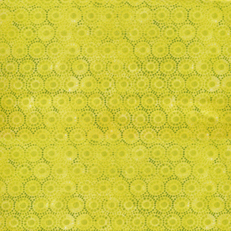 Chartreuse green fabric with distressed geometric circle designs in rows all over