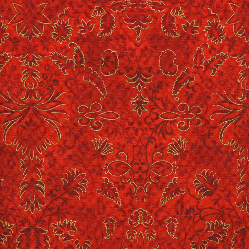 Red fabric with tonal floral patterns swirling across it  and gold accents