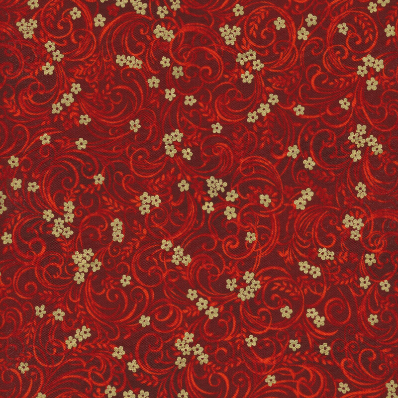 Red fabric with tonal floral patterns swirling across it  and gold flower accents
