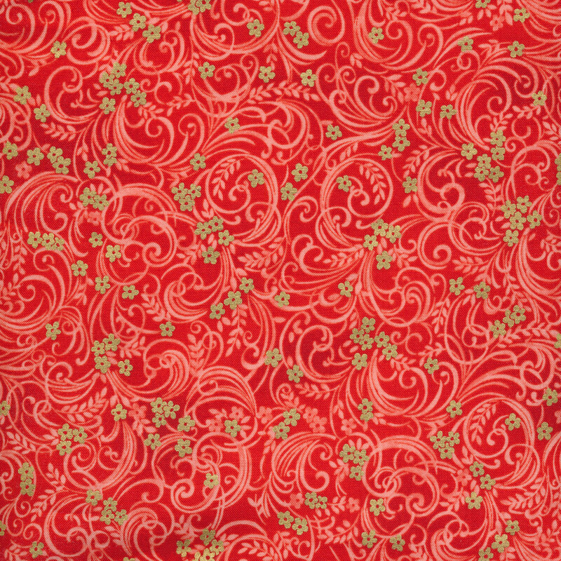 Orange-red fabric with tonal floral patterns swirling across it and gold flower accents