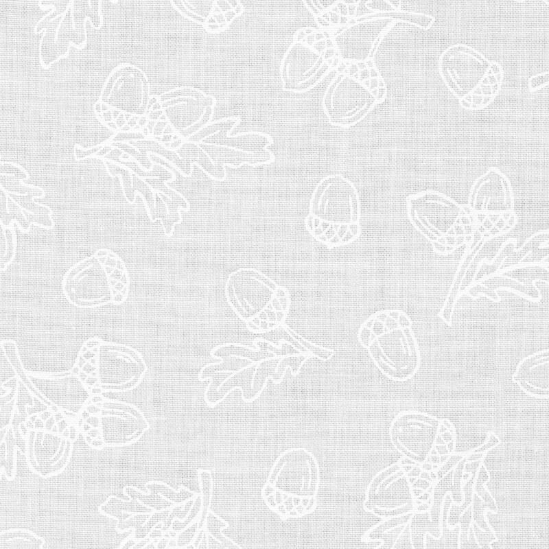 digital image of fabric with white acorns and leaves tossed on a white background
