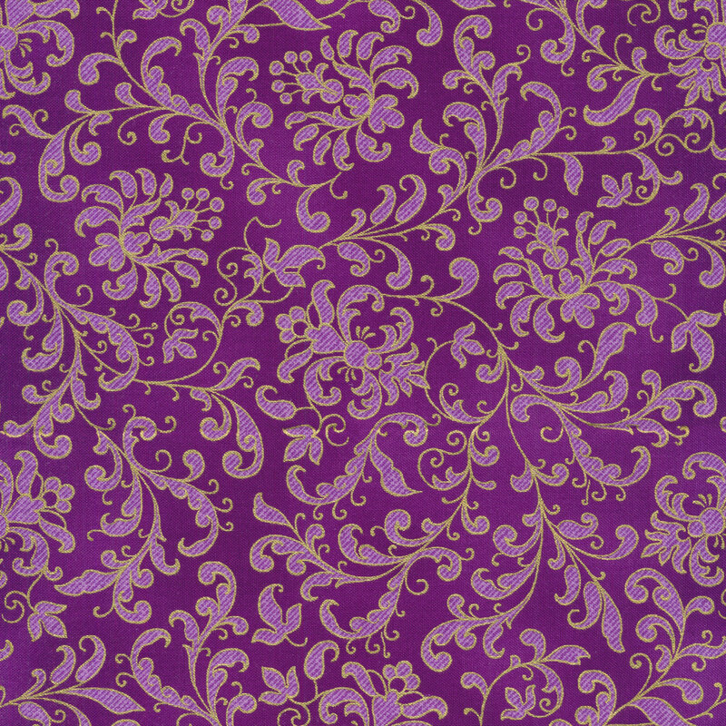 medium purple fabric with light purple floral filigree and swirls all over, edged with gold metallic accents