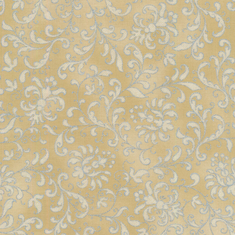 Creamy-gold mottled fabric with cream floral filigree and swirls all over, edged with silver metallic accents