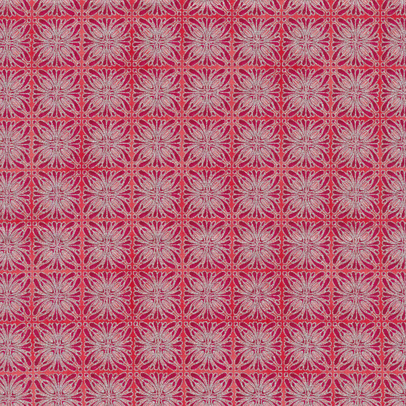 Hot pink fabric with kaleidoscopic square designs in silver and dark pink stacked closely together