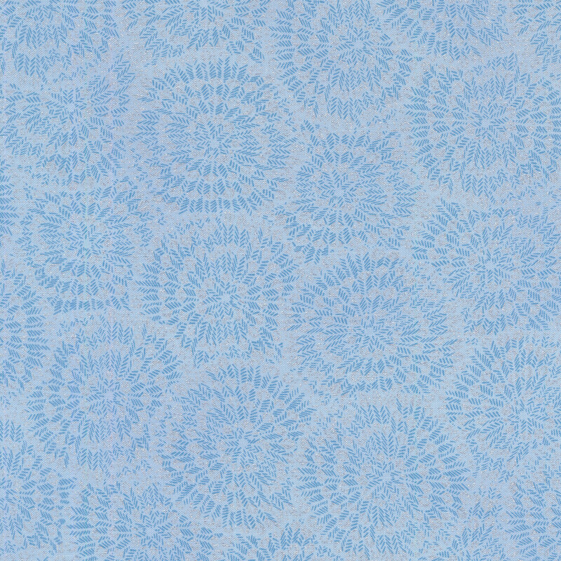 Light blue fabric with burst-like patterns made up of tiny blue chevrons and silver accents