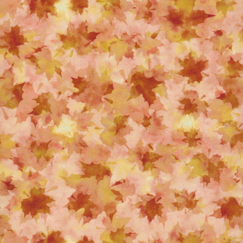 Fabric with overlaid maples leaves in shades of orange and yellow