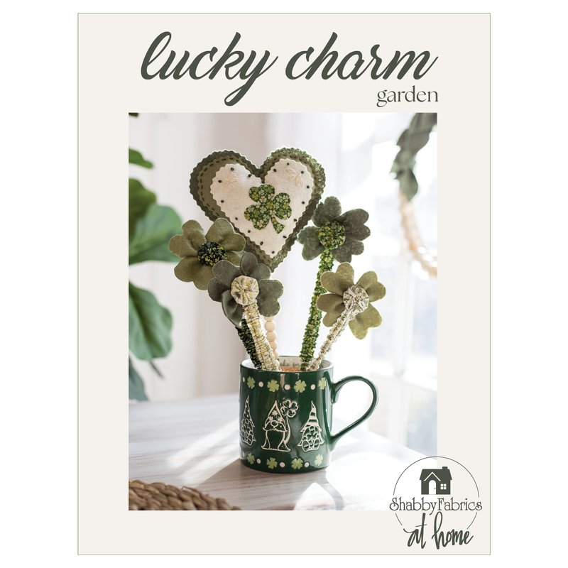 front cover of Lucky Charm Garden pattern with a photo of the completed project sticking out of a  green gnome mug