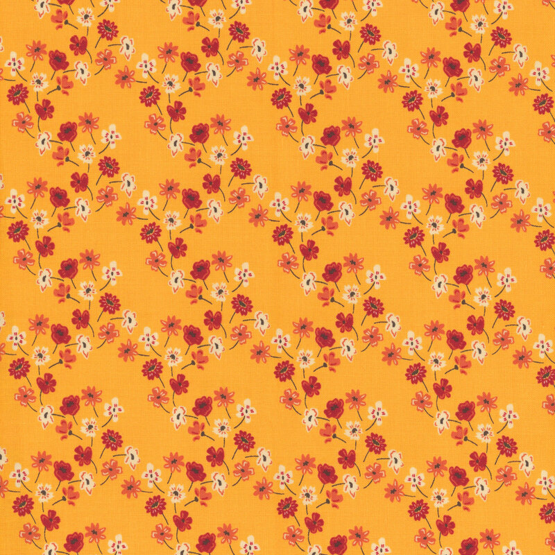 fabric with orange, yellow and red flowers forming a lattice across a golden yellow background