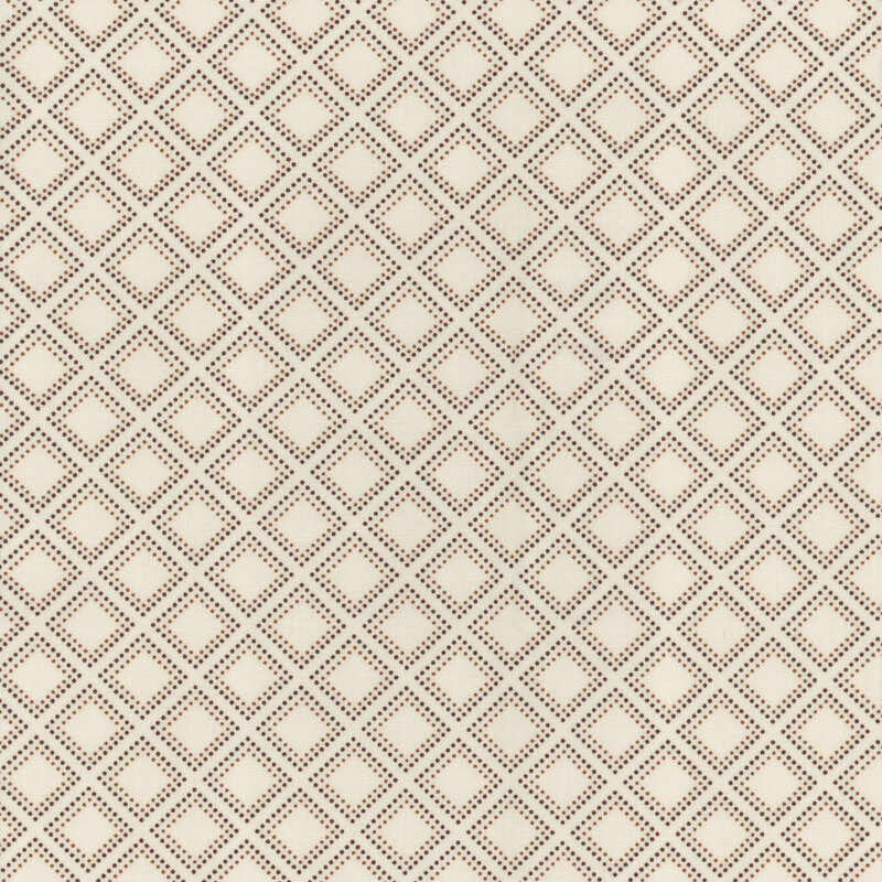 fabric with black and brown dots forming a diamond on a cream background