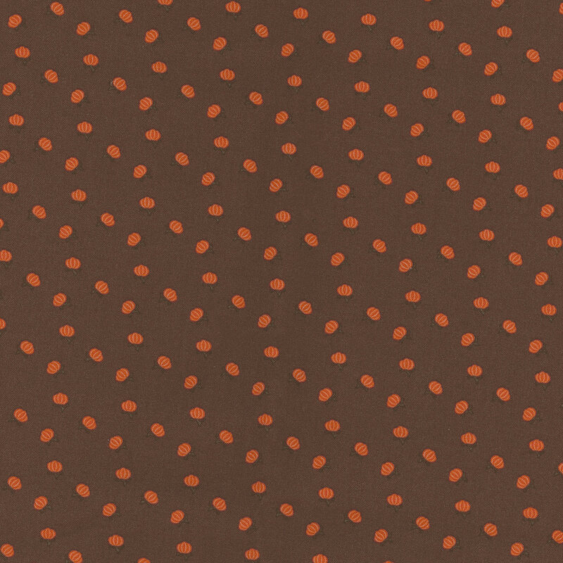 fabric with tossed ditsy pumpkins on a solid brown background