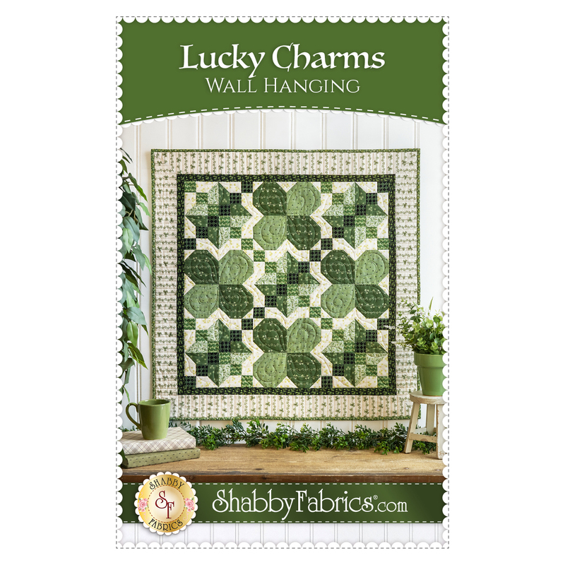front cover of pattern, with the title at the top, and a picture of a quilt with four pieced blocks in various shades of green, and Irish Chain blocks in various shades of green
