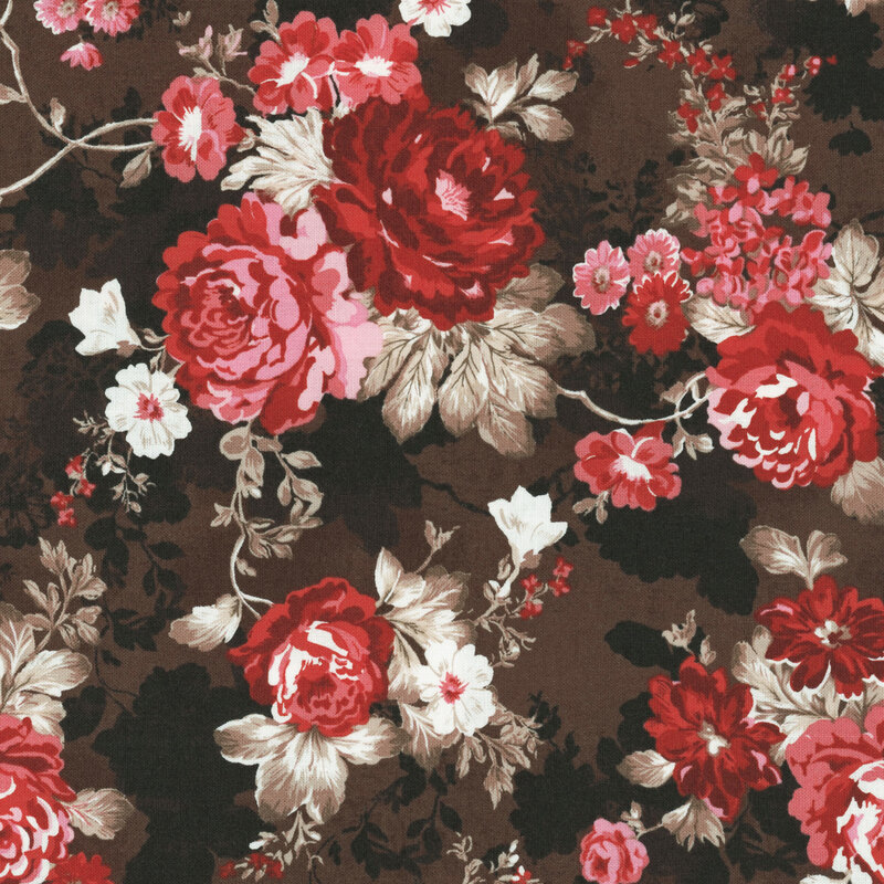 fabric with pink and red roses with various blooms with tan leaves on a dark brown background