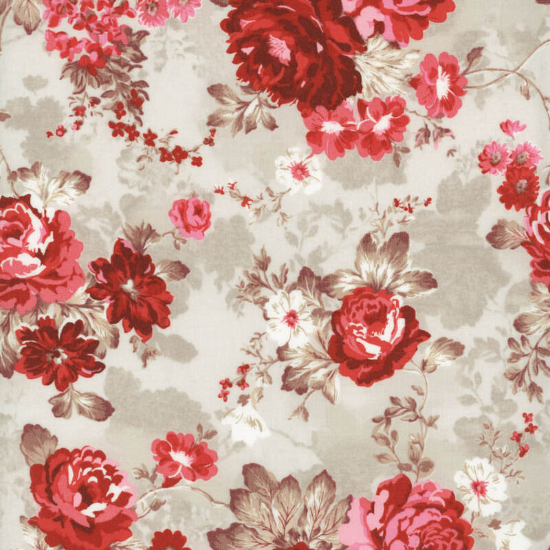 fabric with pink and red roses with various blooms with tan leaves on a cream and white background