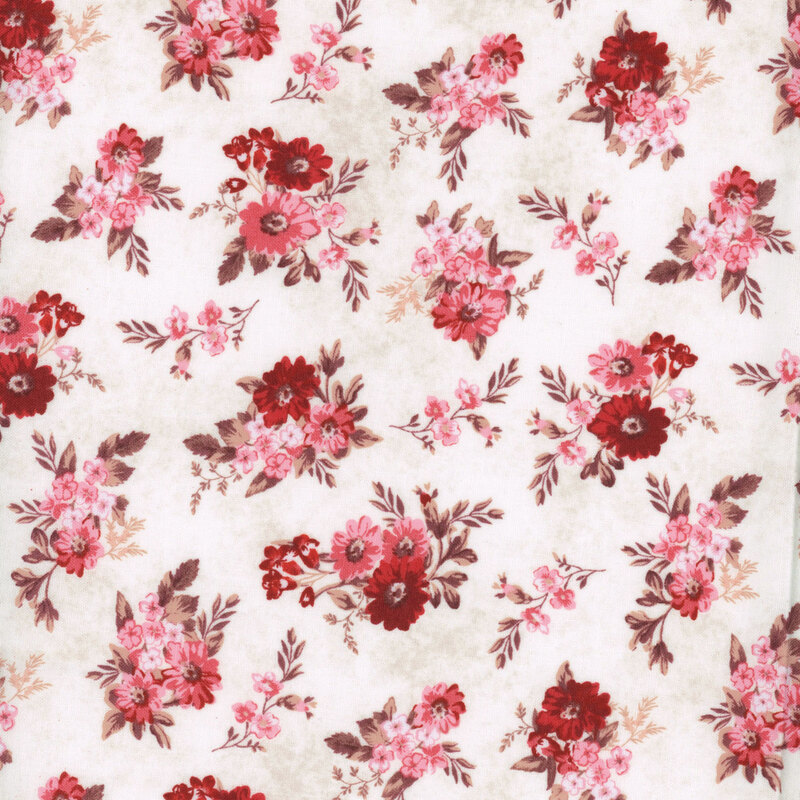 fabric with red and pink flower clusters with tan leaves on a cream background