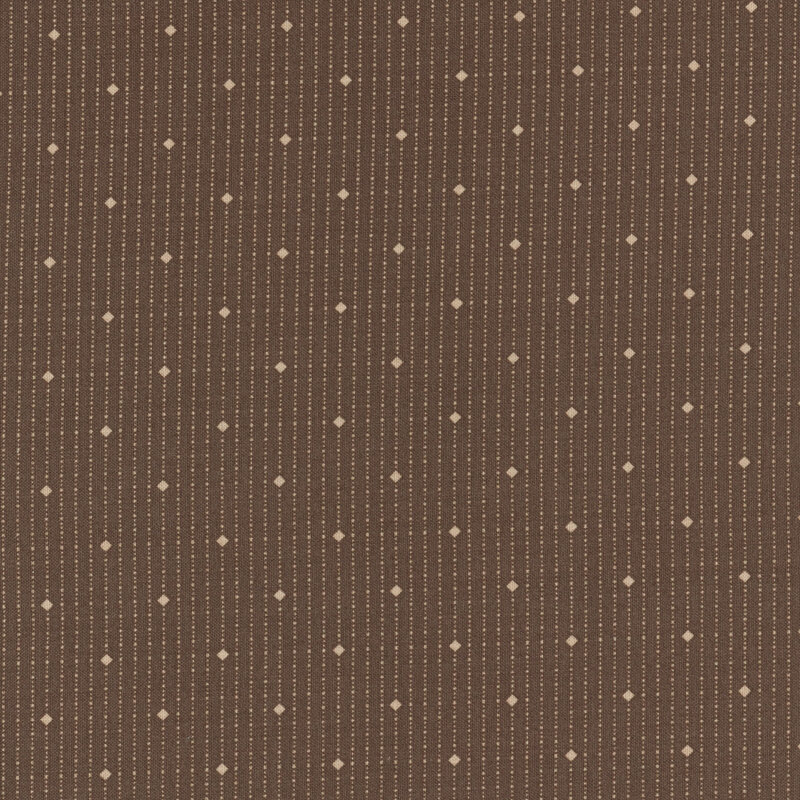 diamonds and dots in cream on a dark brown background