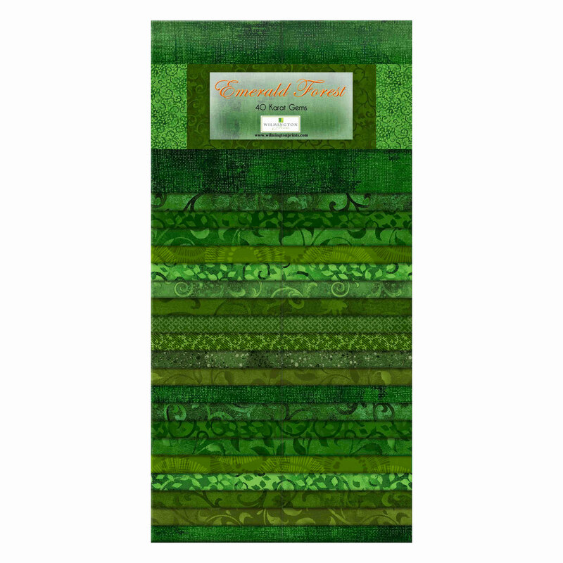 A pack of tonal green fabrics with various patterns layered and repeated with a label on the front