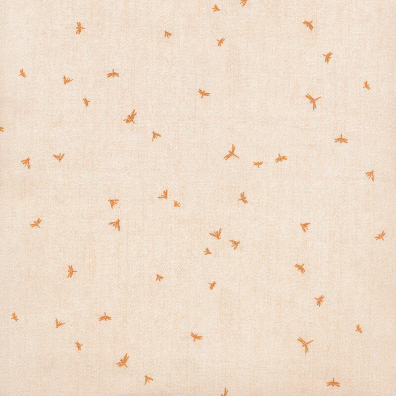 pale pink fabric with ditsy gold soaring dragonflies