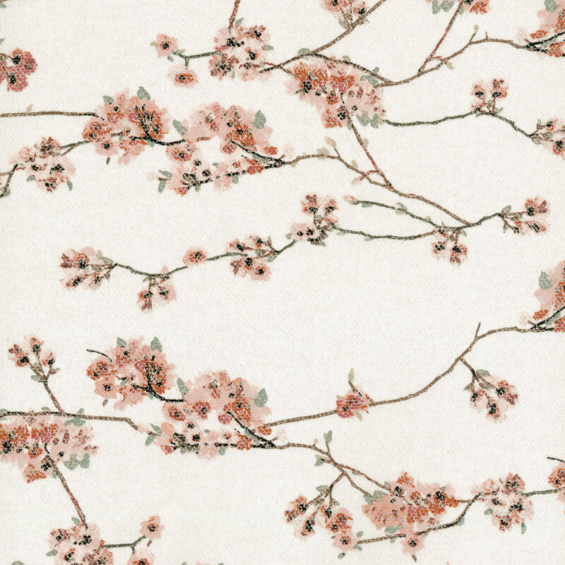 fabric featuring pink blooms and sprawling branches across a cream background