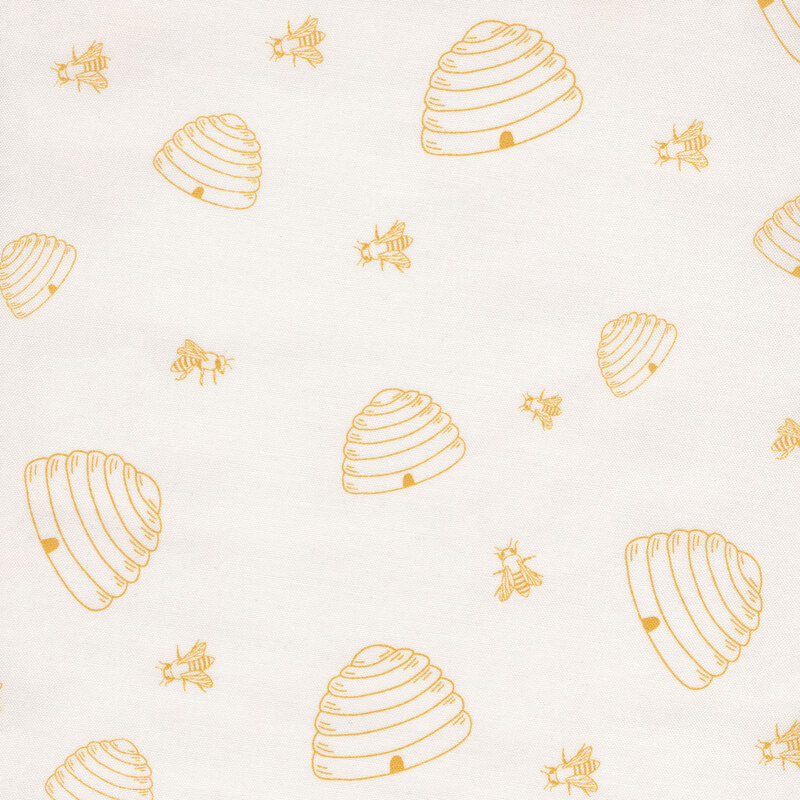Fabric with yellow bees and beehives on a cream background